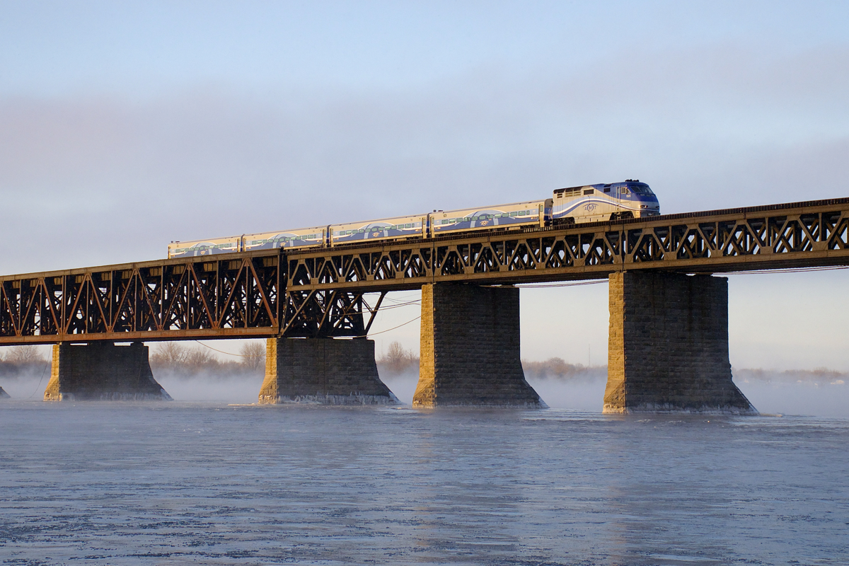 It was well below freezing in Montreal today and a bit of snow fell, so I figured I'd post a shot from a very cold morning last winter.... Here F59PHI AMT 1325 pushes a deadhead move towards the South Shore of the St. Lawrence River, to get more commuters for Montreal.