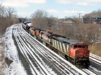 Loaded oil train CN 710 is slowing down for a crew change at Turcot West during the winter of 2015 with a spectacular lashup: CN 2406, BCOL 4624, BNSF 6382 & BNSF 9804. This train would stop running a few months later.