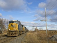 CSXT's 25 ex-EMDX SD70M's were mostly captive to Florida until recently, but can now be found systemwide. Here CSXT 4693 (ex-EMDX 7018) is leading a 103-car CN 327 (with ET44AH CSXT 3255 trailing) as it approaches Coteau.