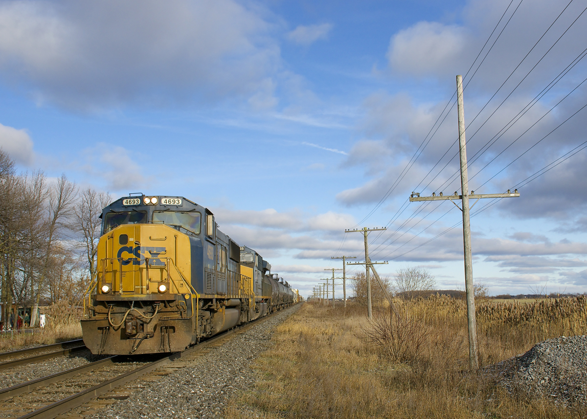 CSXT's 25 ex-EMDX SD70M's were mostly captive to Florida until recently, but can now be found systemwide. Here CSXT 4693 (ex-EMDX 7018) is leading a 103-car CN 327 (with ET44AH CSXT 3255 trailing) as it approaches Coteau.