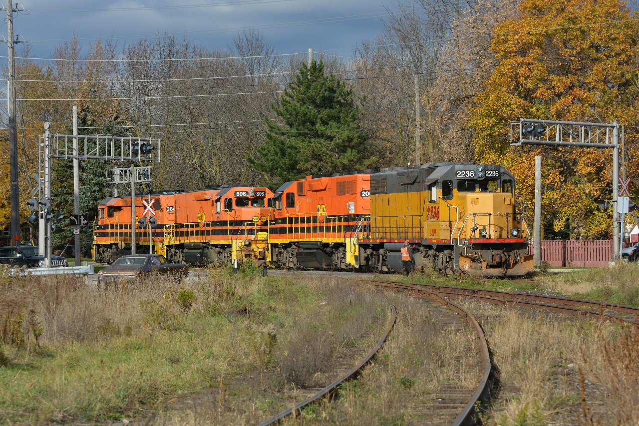 The locals of Guelph go about typical daily operations where 582 from Cambridge will interchange with 580 from Kitchener. Pictured, 580 reversed over the crossing to allow 580 to drop their train in XV yard. Operations went as followed... 580 pulled forward after cutting their train and needed more room to clear the switch causing 582 to reverse further, 580 then reversed further, 580 pulled forward in to the wye, 582 pulled forward to pick up 580's train to take to North Guelph, 580 came out of the wye, switched the yard, and then reversed 15 or so cars back around the wye to the main.