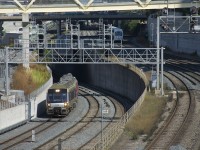 A three-car Union Pearson Express train is westbound on the flyunder west of Union Station in Toronto.