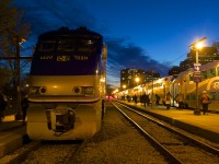 A pair of AMT trains at Lucien L'Allier Station at dusk.