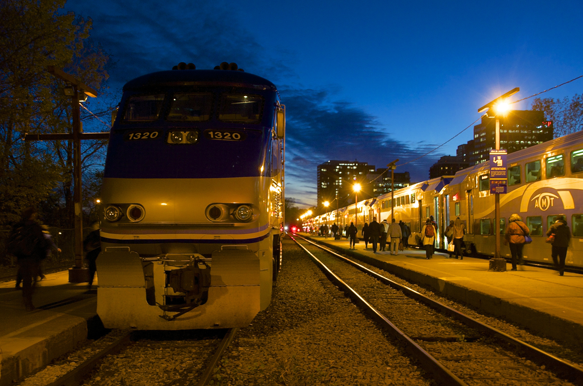 A pair of AMT trains at Lucien L'Allier Station at dusk.