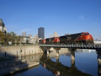 On a cloudless morning, CN 149 is leaving the Port of Montreal with three AC units (CN 2908, CN 8100 & CN 2967) arranged elephant style. If CN 149 is on time (which it usually is), this angle is only doable with good lighting during the shorter days of late fall and early winter.
