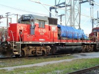 A Goderich & Exeter GP40 that had been in storage at ONR's North Bay shop is seen at the Agincourt fuel stand with it's long hood missing and the engine covered with a tarp.