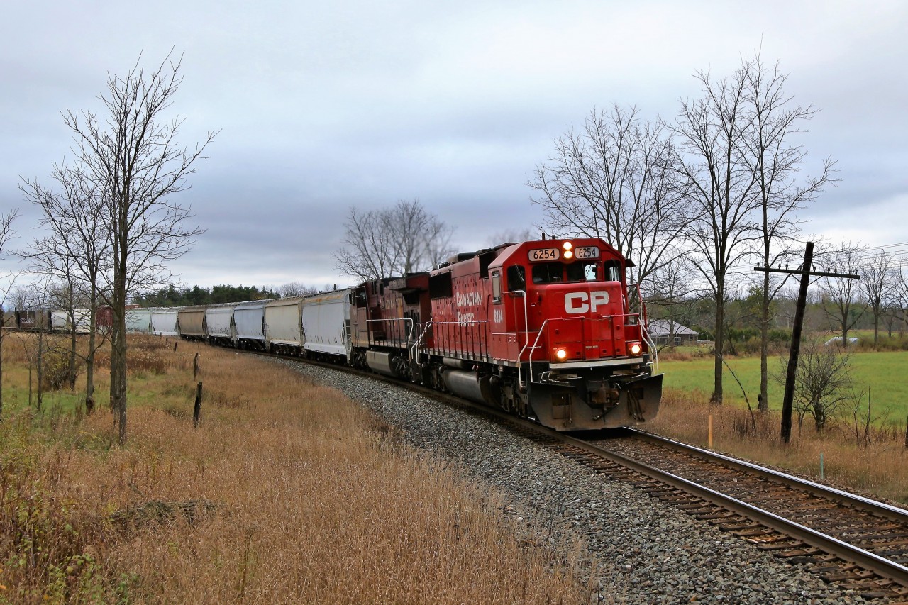 It was a good day for being a rail fan with two trains going by in forty-five minutes with a pair of EX-SOO, SD60's leading. CP 147 had CP 6223 leading and here is CP 240 led by CP 6254 on its way to Guelph Junction. What a contrast in paint to the dirty CP 8604 trailing!