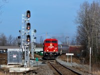 A freshly refurbished CP 9715 leads CP 246 past the newly installed signal lights, name sign and RTC controlled switch on its way down the Hamilton sub,