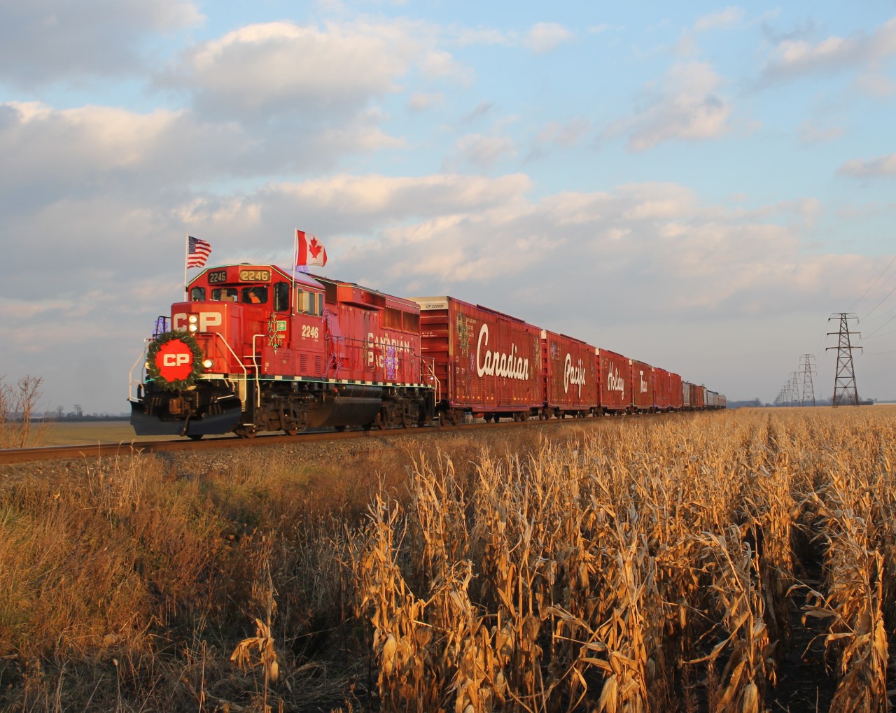 After having a meet in Tilbury with CP 140, the US Canadian Pacific Holiday Train dashes by a field on its' way to Windsor. This was taken at Gracey Side Road roughly halfway between Tilbury and Haycroft.