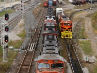 It has been years since I've seen Hamilton yard this busy. It would appear that train 421 was running quite late as it stopped to work Hamilton yard at around 11am after working Aldershot. CN train 555 in the distance has just finished working the bulk transfer facility and was now backing up to the office, while a lone SOR GP38 drills cars in the yard.