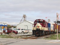 The feed mill at Belmont last saw rail service long before CP transferred the St. Thomas subdivision to the OSR. While the siding here was severed at the crossing years ago its ends still see occasional use for car storage when needed. This day a cut of LPG tank cars were being stored on the west end of the former siding. The tank cars on today's train are destined for the CN yard in St. Thomas while the short cut of NS boxcars will be dropped at an industry on the outskirts of St. Thomas.