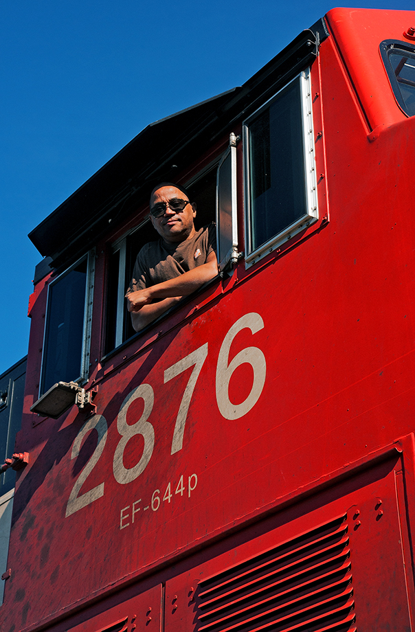 The man and his machine, Engineer Phil Hall strikes a pose from the window of his lead unit, CN 2876. I was his conductor that day, called for a 570 to Oshawa and return (Jane St. trade off and train id reprofile). While we were a short train on the return to Mac, we would sit on the York Sub for CN 148 to come off the hill before we get our light and thus the chance to take the photo.
