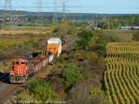 This was supposed to run at night but thanks to a delay, this D9R with Hydro One's HEPX 200 is running in early morning light beside cornfields at Mansewood (Milton) Ontario. Originating at Hydro One's central stores in Pickering Ontario this load was interchanged by CN to the Southern Ontario Railway at Brantford to be delivered to Franklin Yard in Nanticoke on October 1 2017 with the final move by truck. These moves seem to happen about once to twice a year so they aren't super rare, but you have to be in the right place and the right time to see it. The other thing that complicates HEPX 200 moves are the availability of Hydro One employees who ride with their equipment - after making this move the Hydro One crew took rest, SOR ran their extra anyway but ran light power to Brantford on September 30. At 0800 on October 1 crews were ordered to meet at Brantford and they ran this to Nanticoke - Here's a photo at <a href=http://www.railpictures.ca/?attachment_id=30873 target=_blank> Caledonia</a> with more to come, eventually.