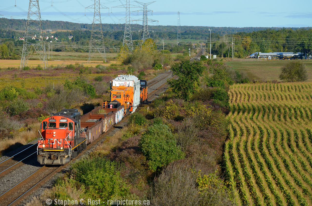 This was supposed to run at night but thanks to a delay, this D9R with Hydro One's HEPX 200 is running in early morning light beside cornfields at Mansewood (Milton) Ontario. Originating at Hydro One's central stores in Pickering Ontario this load was interchanged by CN to the Southern Ontario Railway at Brantford to be delivered to Franklin Yard in Nanticoke on October 1 2017 with the final move by truck. These moves seem to happen about once to twice a year so they aren't super rare, but you have to be in the right place and the right time to see it. The other thing that complicates HEPX 200 moves are the availability of Hydro One employees who ride with their equipment - after making this move the Hydro One crew took rest, SOR ran their extra anyway but ran light power to Brantford on September 30. At 0800 on October 1 crews were ordered to meet at Brantford and they ran this to Nanticoke - Here's a photo at  Caledonia with more to come, eventually.