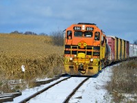There's a very brief period of time where winter and fall mix, and only if we get cold temperatures and a little snow in the mid fall. Farmers have yet to remove their corn husks and a light dusting of snow has painted any bare ground white. GEXR 582 has a rather interesting mixed consist of cars today, but what appears to a multi customer train is apparently, as I am informed, for two customers only - Flochem (just to right) and Hunts Haulage in Preston.