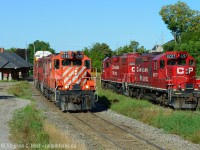 On this Sunday morning I had a plan to go to Kitchener to shoot GO 607 at the Park St Layover facility, and I posted <a href=http://www.railpictures.ca/?attachment_id=11249 target=_blank> this shot </a> a few years ago. Pleased with the result, I decided to make the drive down toward Galt to see what I would find as GEXR was dead as a doornail - The Hagey job wasn't parked at Toyota so I knew something was out on the road, finding nothing on the way I was surprised to find parked power at Galt - perhaps this is the Hagey Job Power was my initial thoughts. I spent time focusing on the details of the power when suddenly a train came backing from Killean - it was the Hagey job with three GP9's for power - at the time Trio's of GP9's were becoming rare.<br><br>On Sundays, Wolverton jobs do not run to Galt so it's up to the Hagey job based out of Toyota on the Waterloo sub to come down to grab cars. The parked power turned out to be for a CWR Train. I set up a shot for a side by side with the ex CPR station in the photo, four GP9's and a GP38-2 in beautiful morning light - followed the train (backlit) to Hagey and ended my morning on a good note :) The sound was amazing of course.<br><Br> I encountered <a href=http://www.railpictures.ca/?attachment_id=20690 target=_blank> 8249 later that winter </a> and it turned out to be one of , if not the last active GP9 as it had it's final days leased out to the Gardiner Dam Terminal Railway while all others were retired, giving it a stay of execution. Last known whereabouts shows 8249 sold in the Fall 2016 CPR auction and to J&L Consulting in January 2017. 