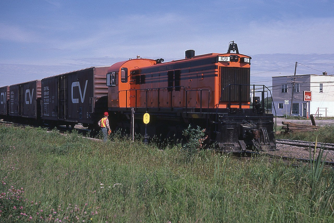 Looking rather spiffy in new paint, recent arrival Spruce Falls Pulp and Paper RS-23 #109 works the extensive Spruce Falls yard in Kapuskasing on a warm August afternoon. This unit originally worked Sydney & Louisburg (NS) as their 201.  Not sure when it left the SFP&P (Tembec) property but I think 2010. Added note: In 1997 the SFP&P became known as Tembec; Spruce Falls division.
