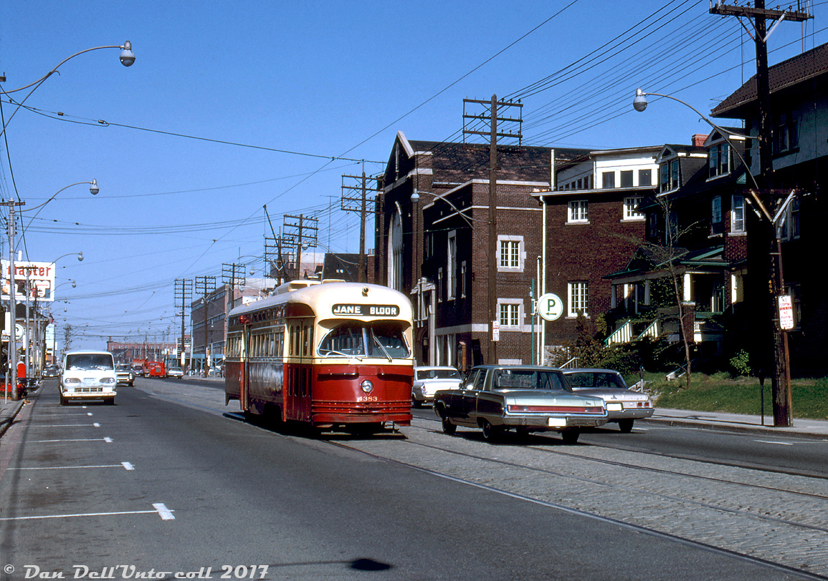 Deadheading on Bloor to Keele Subway Station, TTC PCC 4383 heads west from Dundas Street to enter service on the last day of the "Bloor Shuttle" streetcar service. The Bloor and Danforth streetcar shuttles essentially operated as temporary extensions of the subway line, between the opening of the original B-D subway (from Keele to Woodbine) on February 26th 1966, until the opening of the extensions on either end to Islington and Warden stations on May 11th 1968. The Bloor shuttle operated between Keele subway station's temporary streetcar loop to Jane loop (Jane & Bloor). The next day the subway extensions would open and regular streetcars on Bloor would be a thing of the past. A large group of PCC's would be out of work, with many of the older cars (40/41/4200-series) sold to Alexandria Egypt and loaded for shipment overseas two months later.

Other notable points in this photo include the Toastmaster sign on top of the old Canada Bread factory near the NE corner of Dundas and Bloor, Bishop Morocco SS under construction at the SE corner, and one of those 60's Ford Econoline vans.

Robert D. McMann photo, Kodachrome from the Dan Dell'Unto collection.
