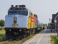 The traveler's assemble and prepare to board VIA Train 71 as it pulls into the Chatham station. On point is the 'Canada 150' wrapped F40PH 6416.  