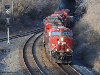 ES44ac unit CP 9369 leads lucky number CP 8888, with trailing GP38-2's CP 3117 and ex-SOO CP 4447 (remote control equipped) into Hamilton on the preferred main track (without wye switches). Units have just passed under the Main Street West bridge.  <br>  Just for fun ... SD40-2  CSX 8888, nicknamed the crazy 8 unit, led a runaway train out of Toldeo in 2001 that was the inspiration for the movie "Unstoppable" - filmed with leased CP AC4400's.
