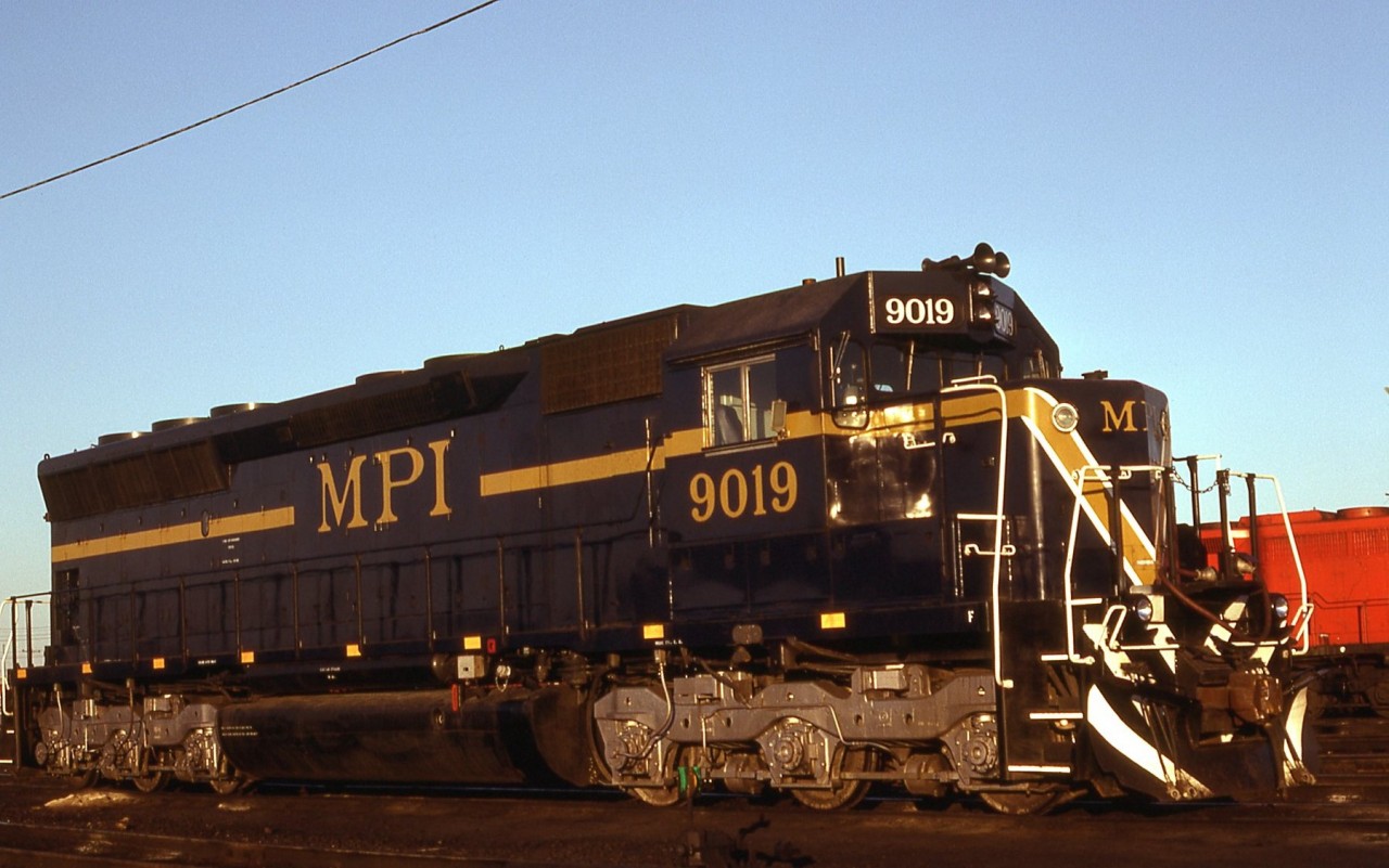 For many years power short CP would rent, lease or test any thing with wheels to keep it trains moving. Here on its first trip in to Toronto MPI SD40m-2 9019 sits ready for service. The 18 cylinder engine has been replaced with a 16 cylinder EMD 645e3, and all the electrical has been updated to dash 2 standards. Early morning sun captures the paint nicely .