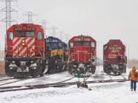 This was an interesting set of moves. The SOO SD60's had come west on an empty tank train, 641, earlier in the morning and were waiting at Jefferson Ave. for a meet with CP 624 lead by CP 6038. When 624 arrived, 641's power detached from their train and pulled into Walkerville yard where SOO 6027 would be dropped. CP 6038 uncoupled from train 624 and was then left in the yard and SOO 6027 was added as the new leader in front of the 3 ICE SD40-2's. SOO 6062 then headed back to train 641 and rode into the US solo, while SOO 6027 departed east with 624's train. I was much more encouraged to sit trackside in inclement weather when these latchups were still common.