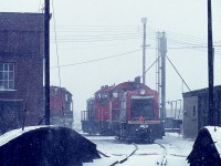 This is just one of those old photos I happened to like, so thought it should be shared. I have long forgotten all the particulars, but the steady snow projects a pleasant tranquility to this scene as taken from the turntable that used to be on the SW side of the old Fort Erie diesel shops. The GP appears to be 4533. Sounds right.
