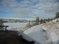 On our trip north this clear cold Boxing Day, it was a beautiful day to be at work and a photo or two. This view is near mile 328 on the BC Rail Prince George subdivision, the first train along this way since Christmas Eve. To the left is Springfield Ranch as well as the Fraser River and valley. Center of the shot in the distance is one of the many rock bluff and points that we will roll past during our trip to Prince George BC. It was a pleasant day.