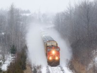 Solo on CN 371, 2588 dashes through the snow on a snowy and cold Wednesday afternoon in Milton. 