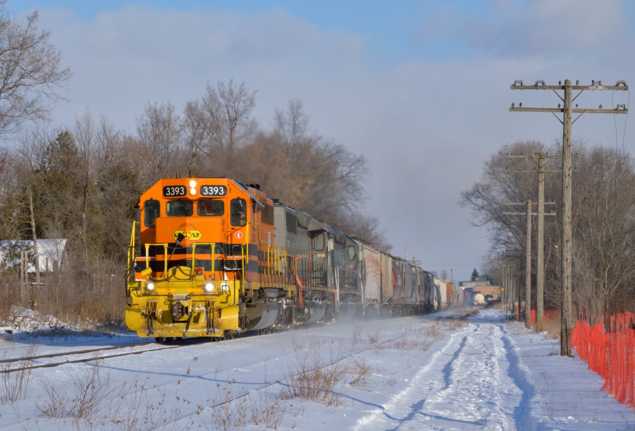 GEXR 431 kicks up some snow as it scoots out of Guelph with a short train for Stratford during a very chilly afternoon.  Here's to a Happy New Year to all fellow railfans!
