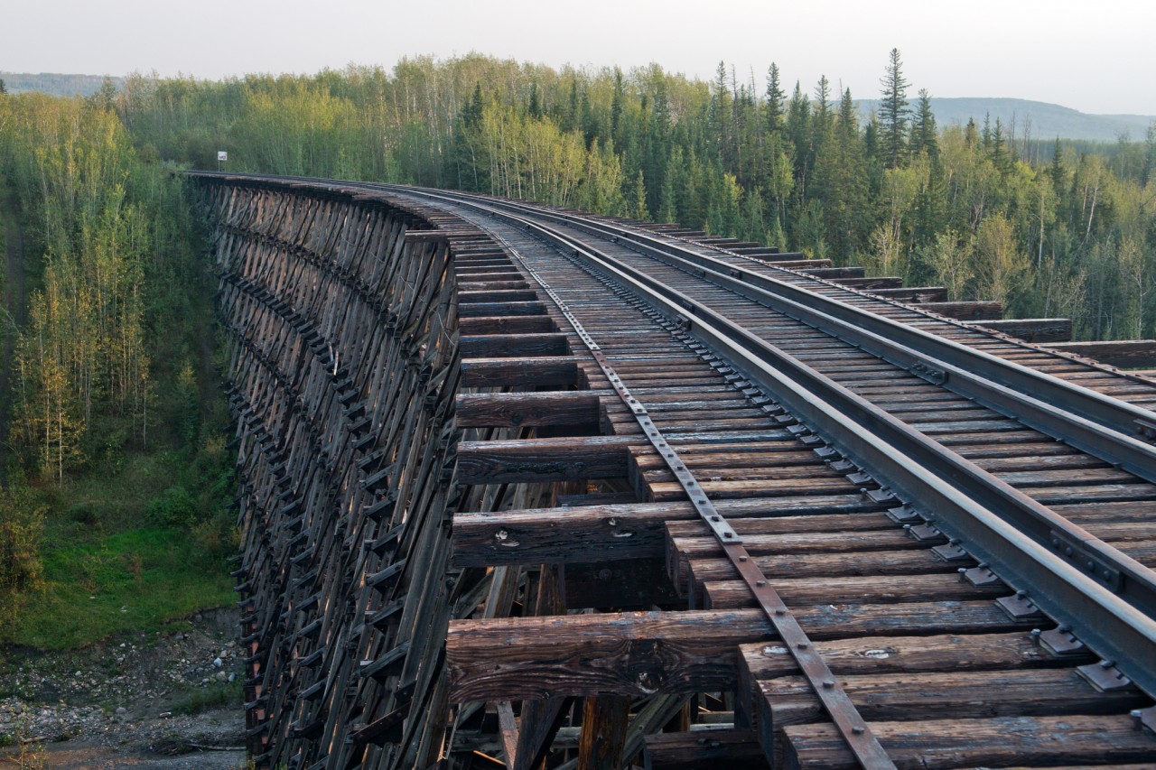This bridge is still part of CN's (former NAR) Grande Prairie Subdivision but with rails removed and crossing's paved over on both sides of it, the chances of ever seeing another train on it are pretty slim.
