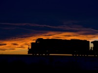 CN 5400 East completes a beautiful sunset scene just west of Irma Alberta on CN's Wainwright Sub.