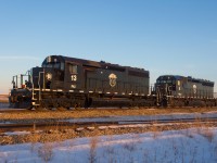 A pair of modern day "critters" soak in the last light of the day. This P&H facility is located along CN's Wainwright Subdivision with CP's Wilkie Sub visible across the highway in the background. With the endless parade of GE's on both railways sometimes monotonous, it's nice to find little windows into the past like these two. #13 began life as CN 5063 while #8 started out as SP 8894