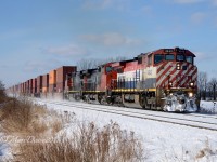 Train 148 with BCOL 4643, CN 2500 and CN 2644 heading east bound out of Sarnia at Waterworks Sideroad on a mostly sunny but frigid day.