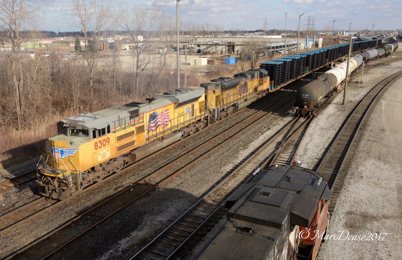These two UP units had been in Sarnia for a couple of days and I was hoping they would be taking 501 across to Port Huron. I got my wish and a little sunshine to go with it at the risk of a heart attack as I was completely gassed by the time I ran up the overpass and snapped off a half a dozen photos. If that wasn't enough I ran back down in order to catch her from the Vidal Street pedestrian bridge.