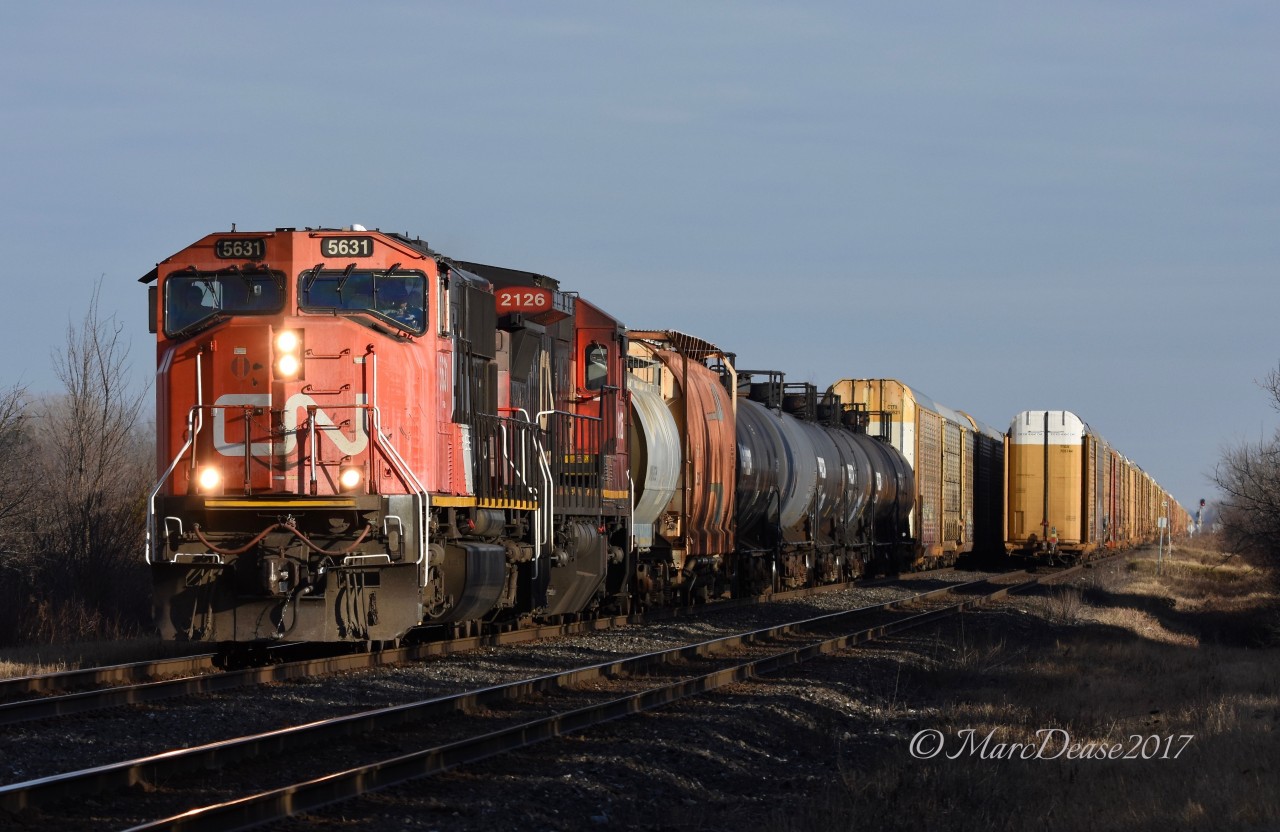 Train 385 west bound for Sarnia, ON., meets a departing train 394 at Telfer Sideroad.