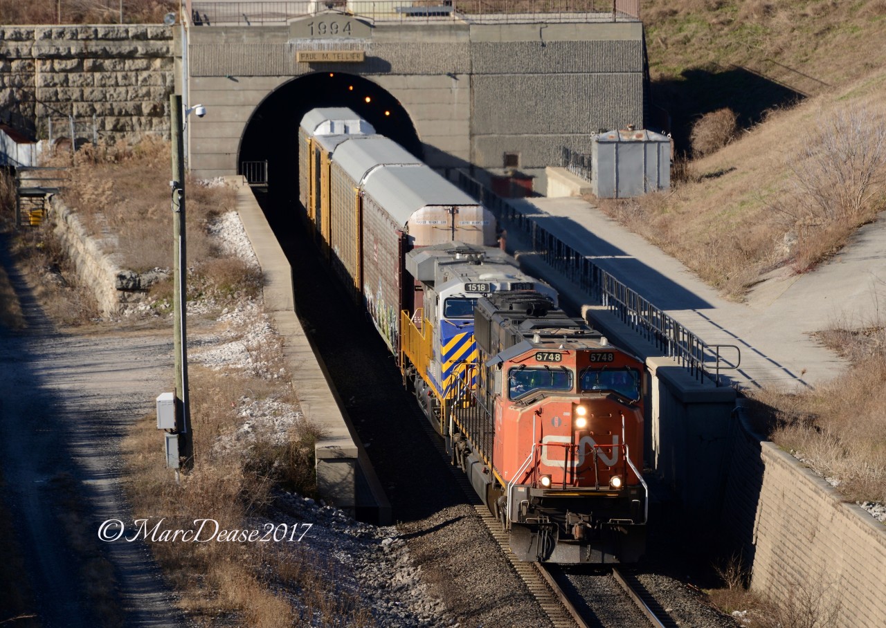Train 394 rolls into Sarnia from Port Huron, MI., via the Paul M. Tellier St. Clair River Tunnel with CN 5748 leading and CREX 1518 trailing.