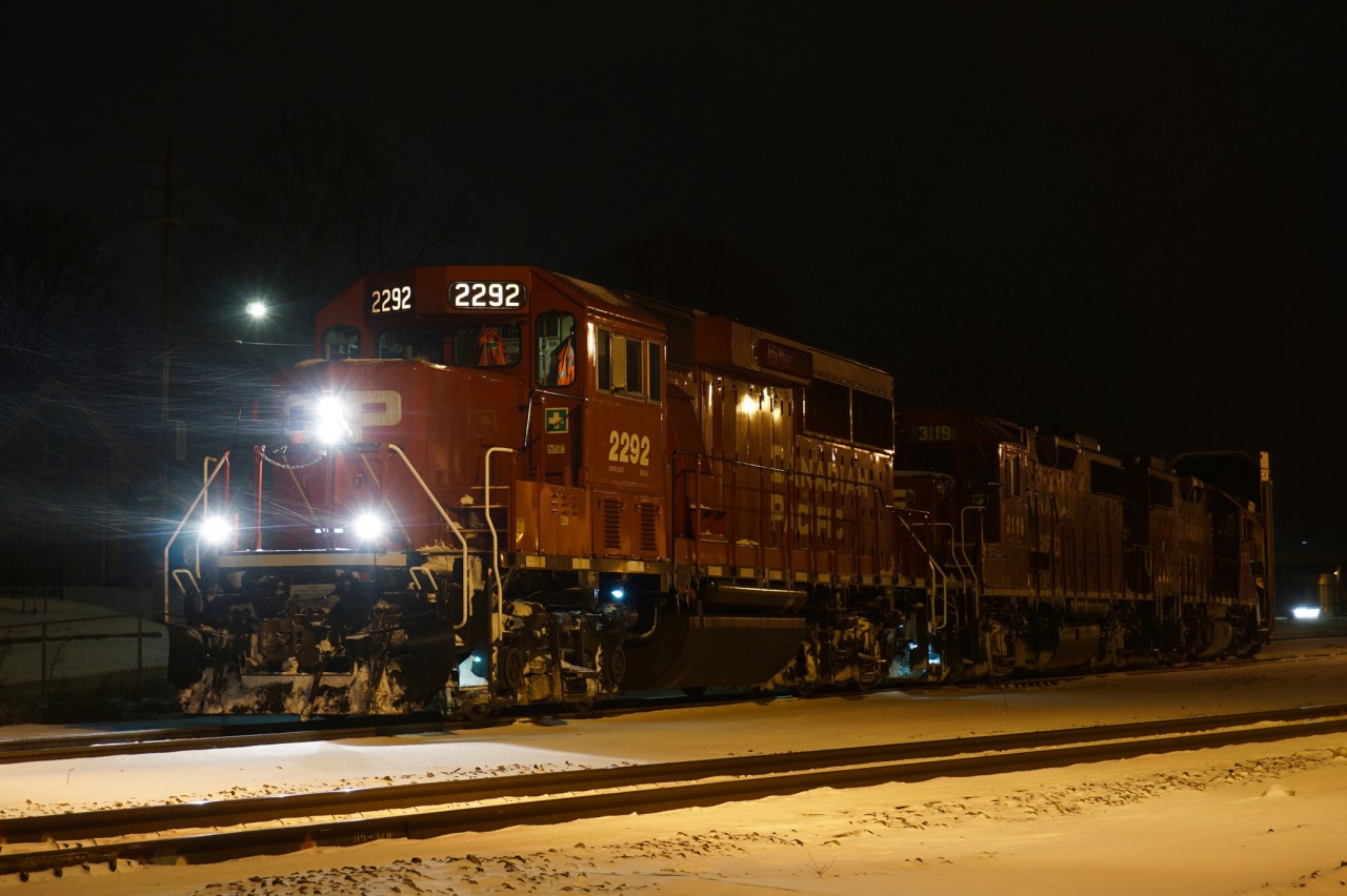 On a snowy night, T69 is about to head back westbound with 3 geeps and 2 autoracks.