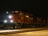 On a snowy night, T69 is about to head back westbound with 3 geeps and 2 autoracks.