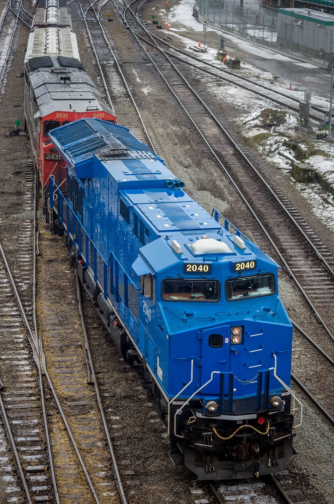 CN has been desperately short of power lately, and management has been drawing locomotives from anywhere possible, resulting in interesting additions to the roster, such as former ATSF SD75M's, CSX/CR C40-8W's, CITI ES44AC's, and in this case, a former GE Tier 4 demo unit that has made its way to the West Coast on a sulphur train, seen here switching in CN's Lynn Creek Yard.
