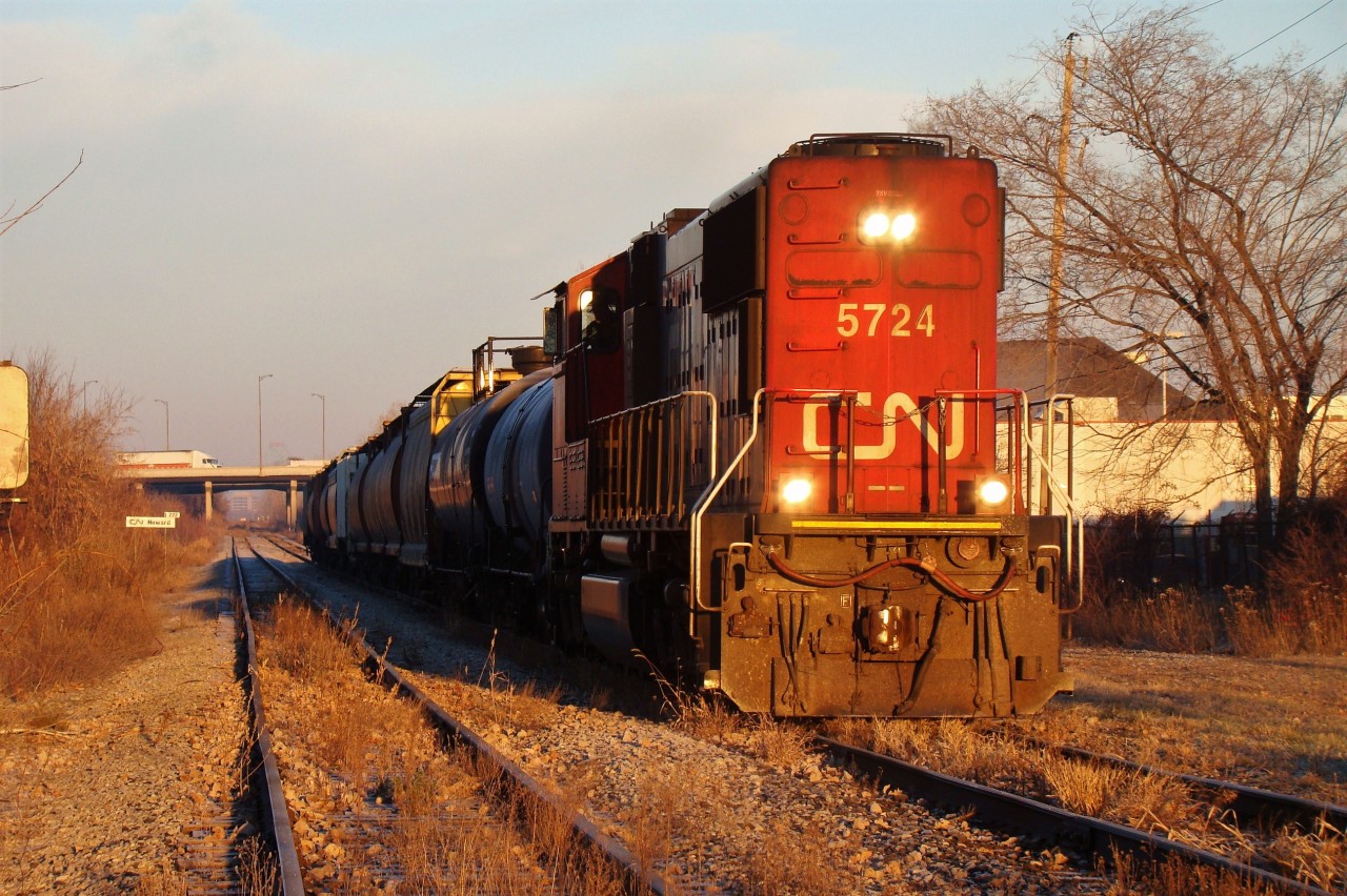 CN 5724 leads a short 12 car 438 out of Windsor on a crisp November morning, back when both lines were in use. The train will crossover to the former eastbound main and head southeast to Essex and Fargo on the CASO, just months before abandonment.