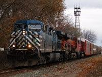 A very dreary fall day finds CEFX 1059 leading this westbound CP freight through Chatham with a colourful consist. The consist includes BNSF 7037 and ex-SOO CP 6258. 