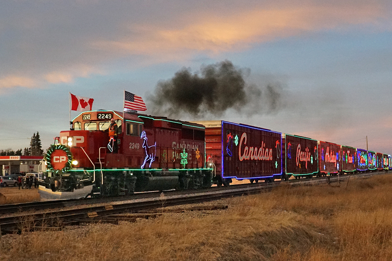 Departing Didsbury just a few minutes after sunset the light has dimmed enough to appreciate the decorative lights of the CP Holiday Train.