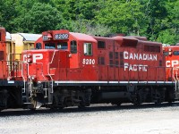 Not wanting to be a trespasser on CP property, I shot what I could from Lawrence Road looking into the Kinnear Yard. This one is an oldie, from my archives, and although in newer CP paint it is then still quite faded. Here,  GP9 8200 sits in the yard, basking in the sun on a Saturday morning in July.