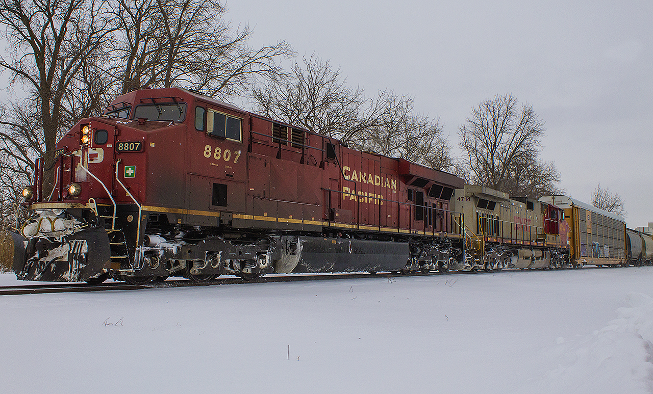 During the season's first major snowfall, CP 141 had a nice surprise in it's consist as BNSF 'warbonnet' 4714 was helping to power behind CP 8807.