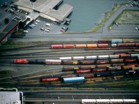 CP Switcher leaving the CP Yard in Vancouver, with mixed freight cars on a rainy day in 1991
