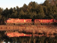 Approaching the south end of Palgrave, 421-27 chugs along the MacTier Sub in some golden evening light.