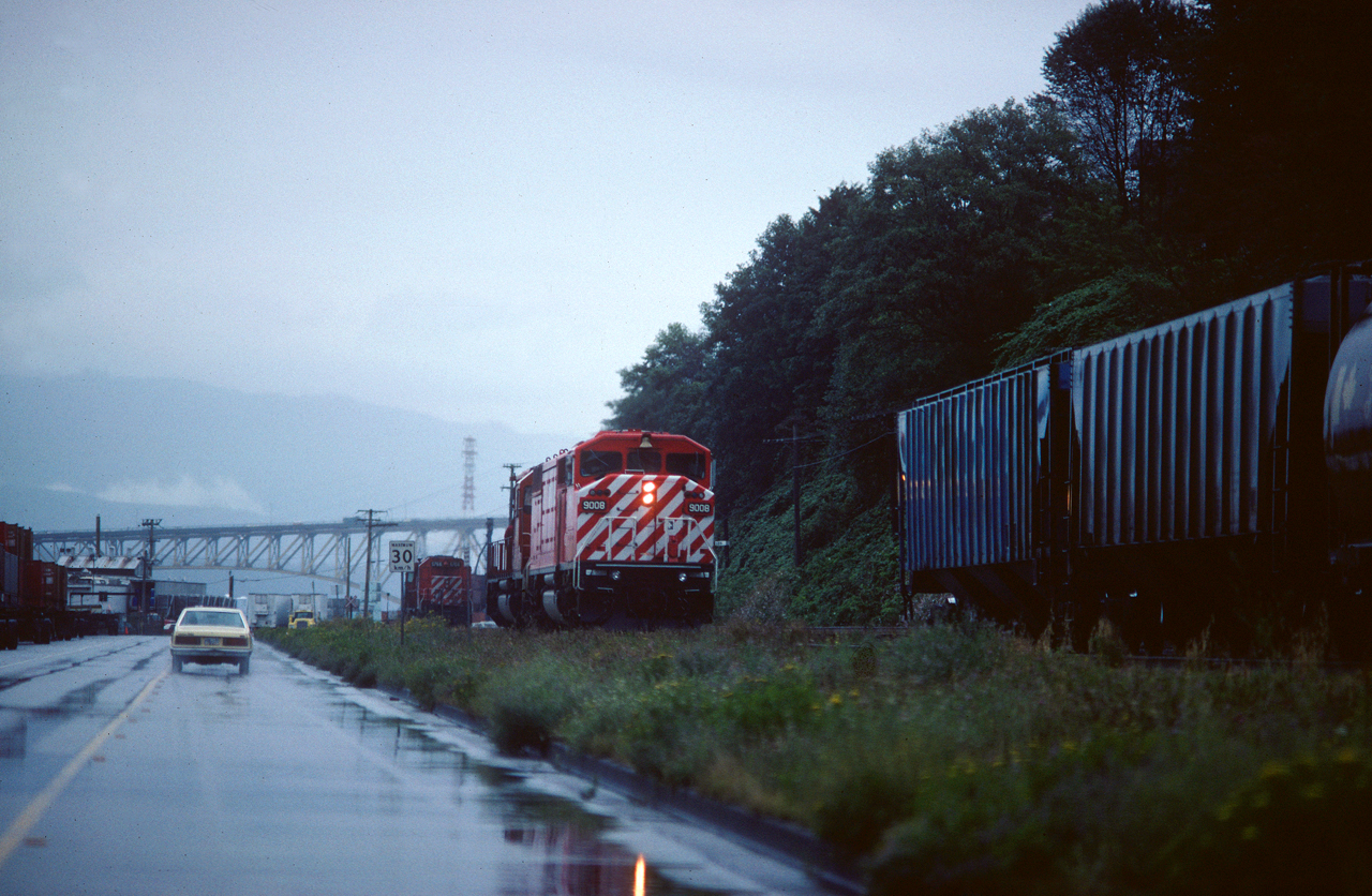 Image from August 1991, 26 years ago , taken with Pentax LX, Kodachrome 64: 
Vancouver on a heavy rainy day : CP#9008, EMD SD 40-2F and EMD SD40-2 CP#5675 (background)