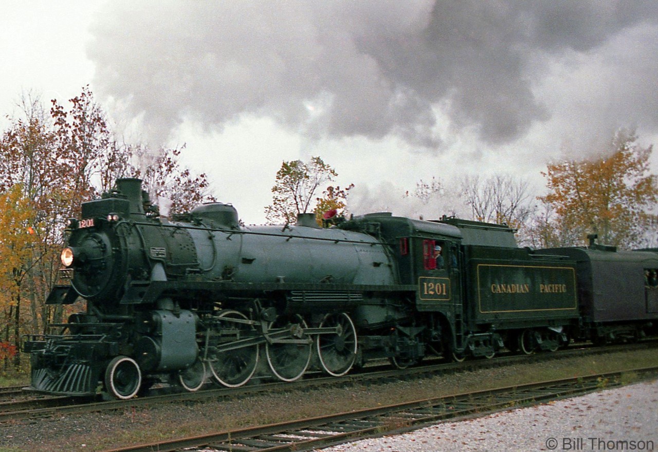 CPR G1-class "Pacific" 1201 is shown operating on an excursion at Maniwaki in 1982. One of the two initial G5 units built by the CPR at its own Angus shops (another 100 G5's followed, built by MLW & CLC), 1201 had been preserved and later restored to operation for a number of excursions in the 1970's and 1980's. It is presently stored out of service at the Canada Science & Technology Museum in Ottawa.