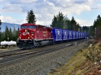 Recently re-painted CP 8620 leads a train load of new potash cars westwards at Berton on the Shuswap sub.